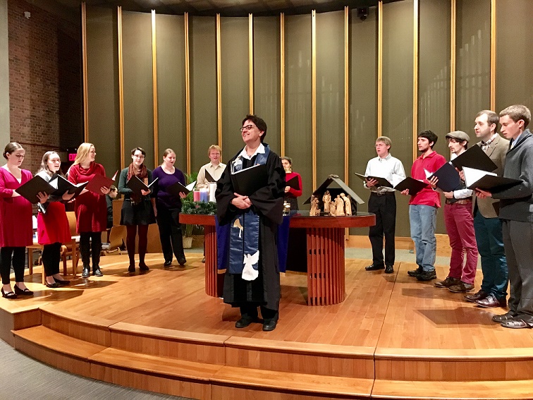 Chaplain Laurie in sanctuary in front of choir